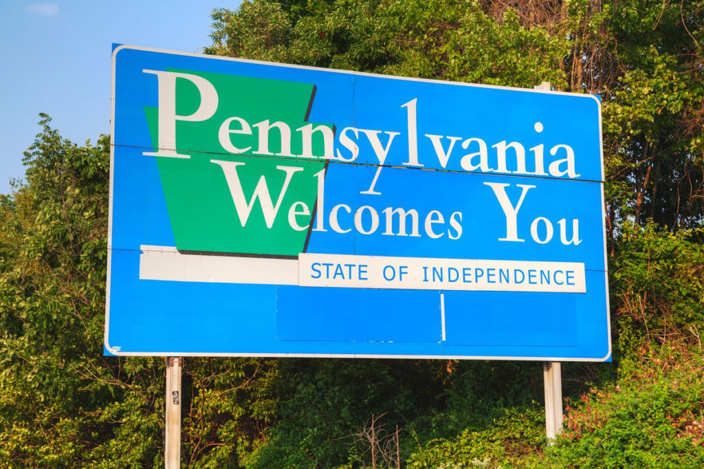 A blue sign that says pennsylvania welcomes you.